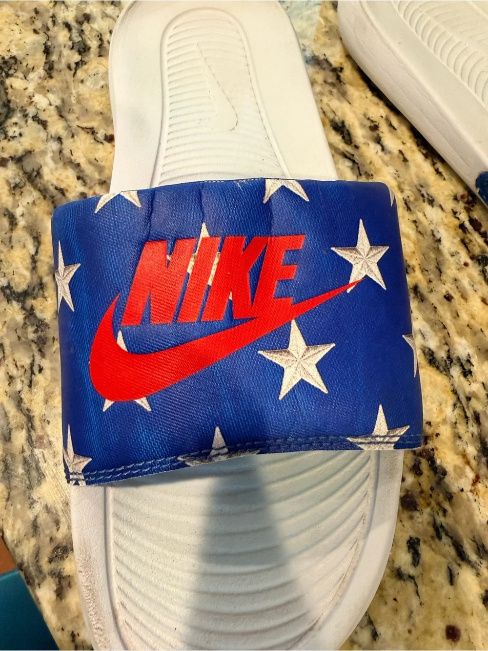 Nike Men’s White Slide Sandals with Blue Star Strap